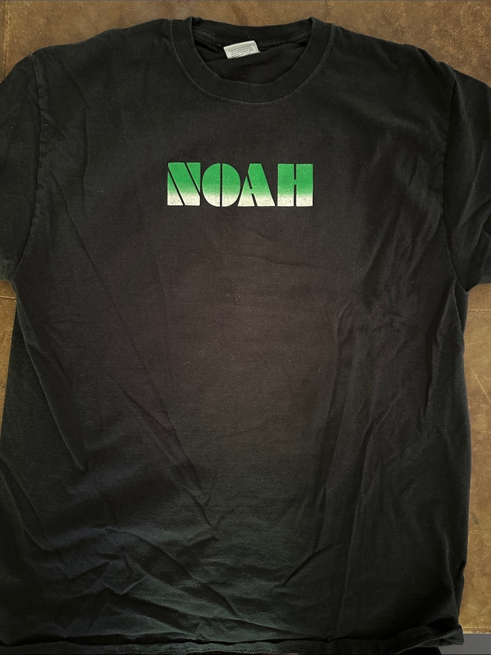 Noah NYC Black Tee with Green-to-White Gradient Logo